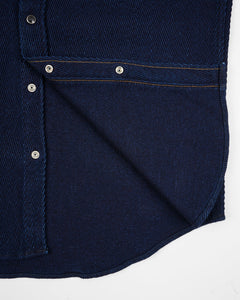 Close-up of a Iron Heart Indigo Kersey shirt with button details on a white background